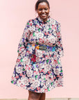 The model is wearing multi-colored floral print