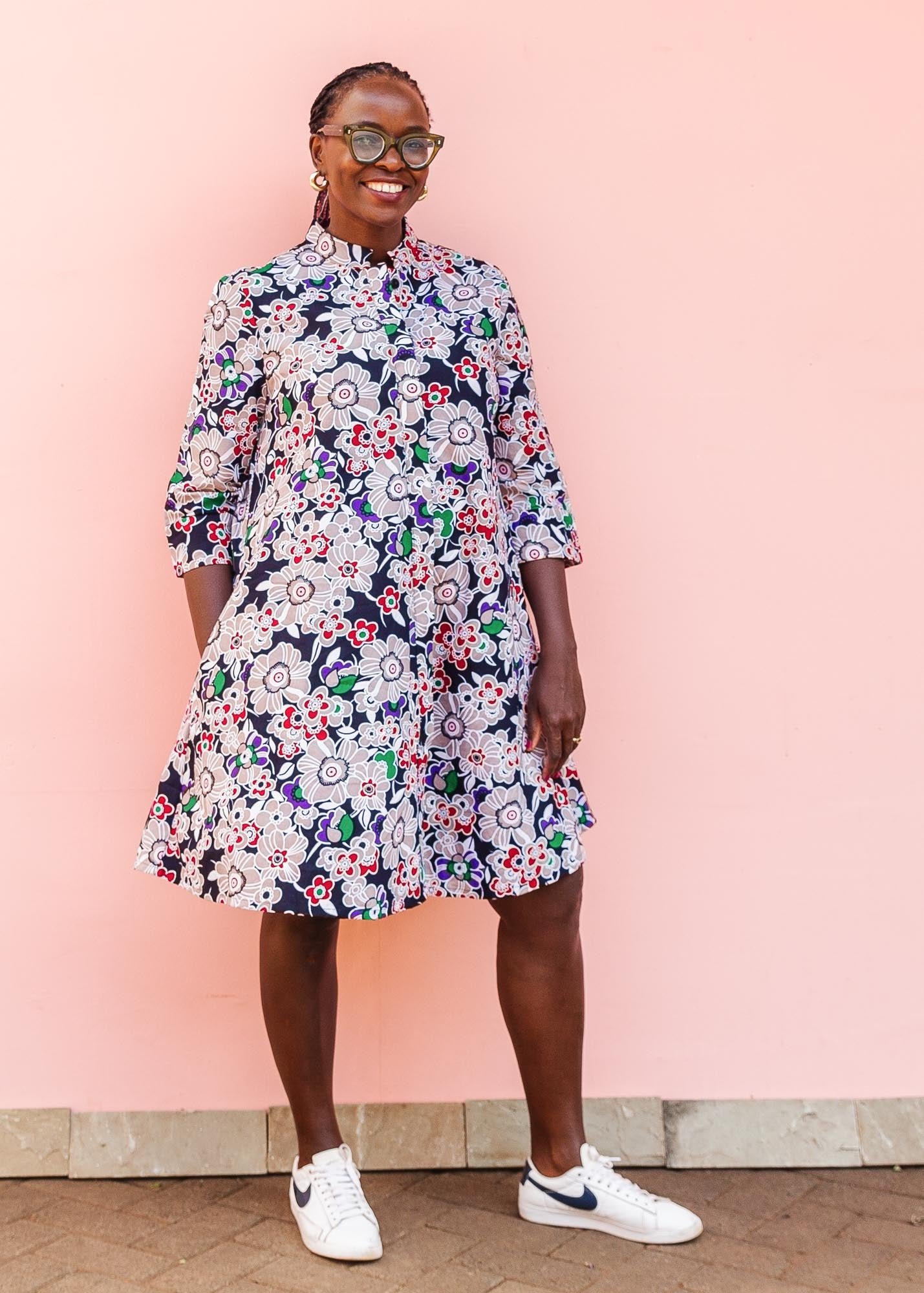 The model is wearing multi-colored floral print