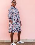 The model is wearing multi-colored floral print 