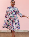 The model is wearing multi-colored floral print