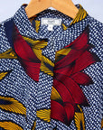 Display of red, yellow and navy flower print dress.