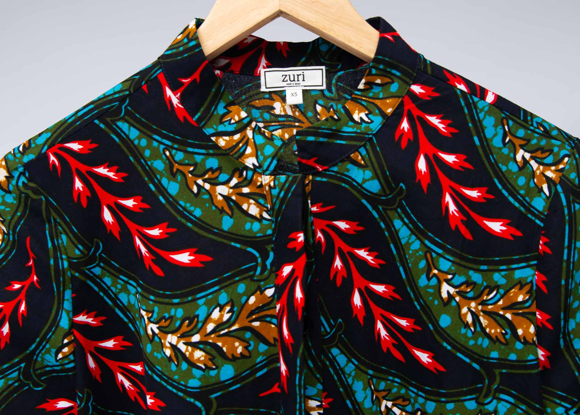 The display of  multicolored leaf print dress
