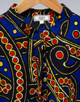 The display blue, red, black, yellow and white ornamental print dress