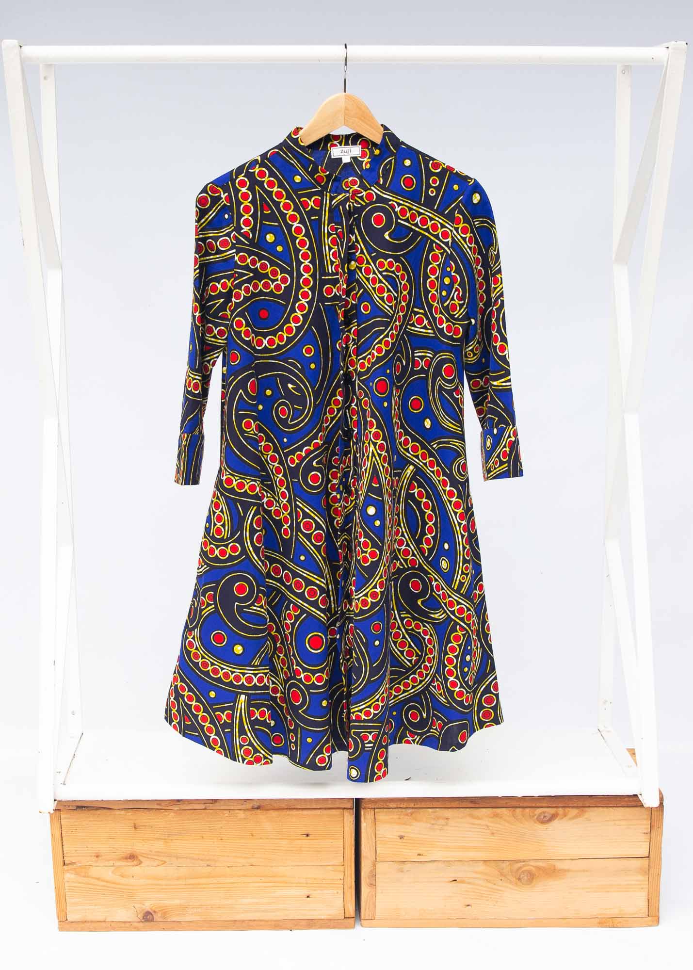 The display blue, red, black, yellow and white ornamental print dress