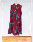 The display of red and black dress with navy blue and beige print