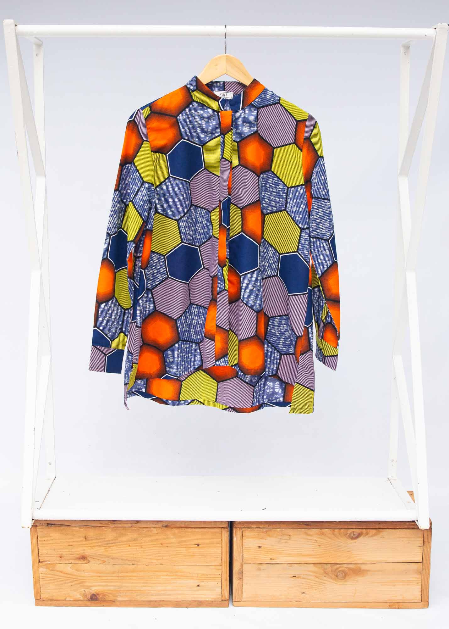 Display of multicolored long sleeved shirt with geometric print