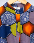 Display of multicolored long sleeved shirt with geometric print