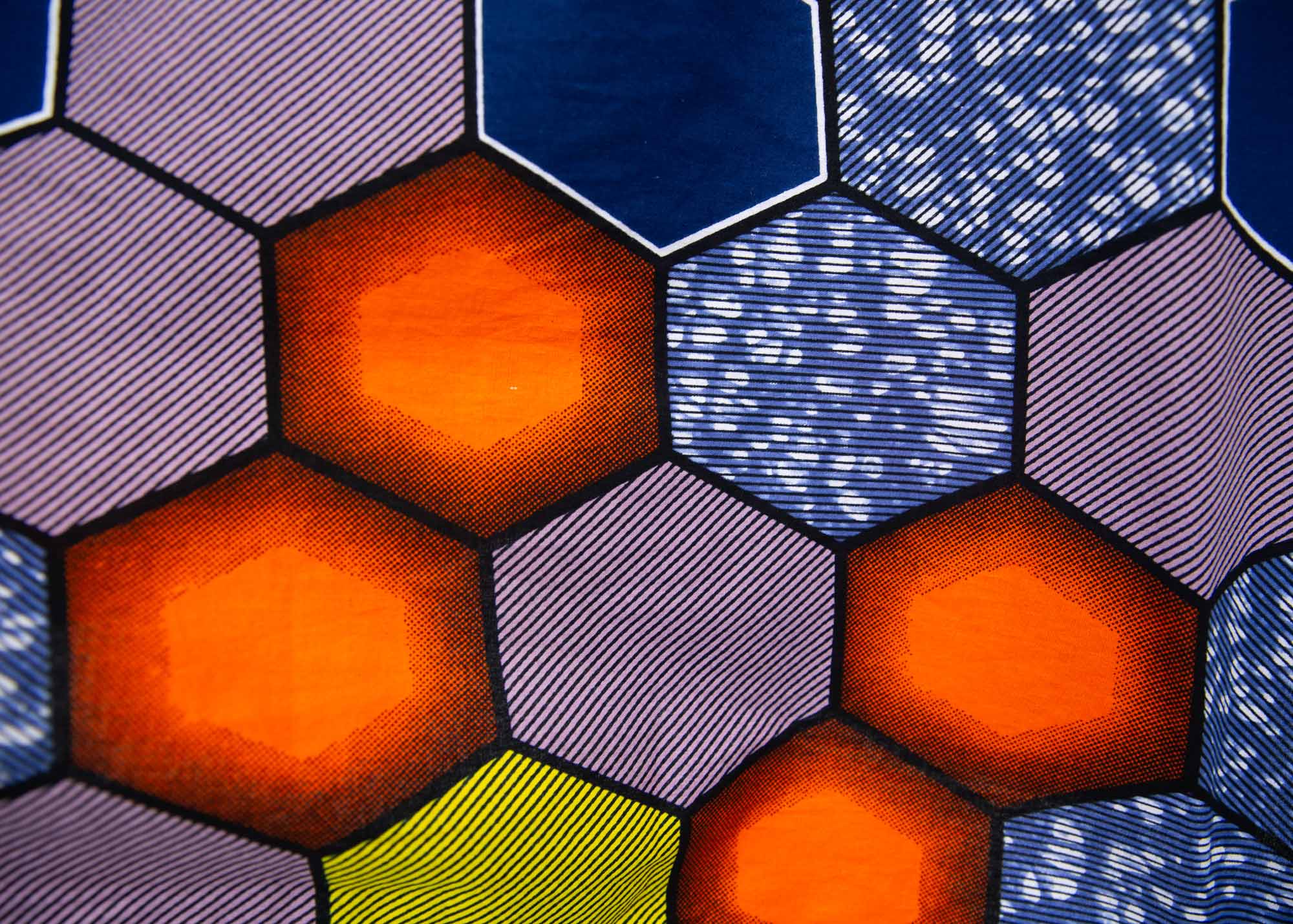 Close up display of multicolored long sleeved shirt with geometric print, fabric