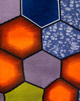 Close up display of multicolored long sleeved shirt with geometric print, fabric