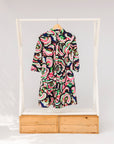 Display of colorful abstract print dress.
