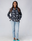 Model wearing black and white long sleeve shirt with Zuri graphic print.
