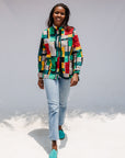 Model wearing mutlicolor abstract print shirt.