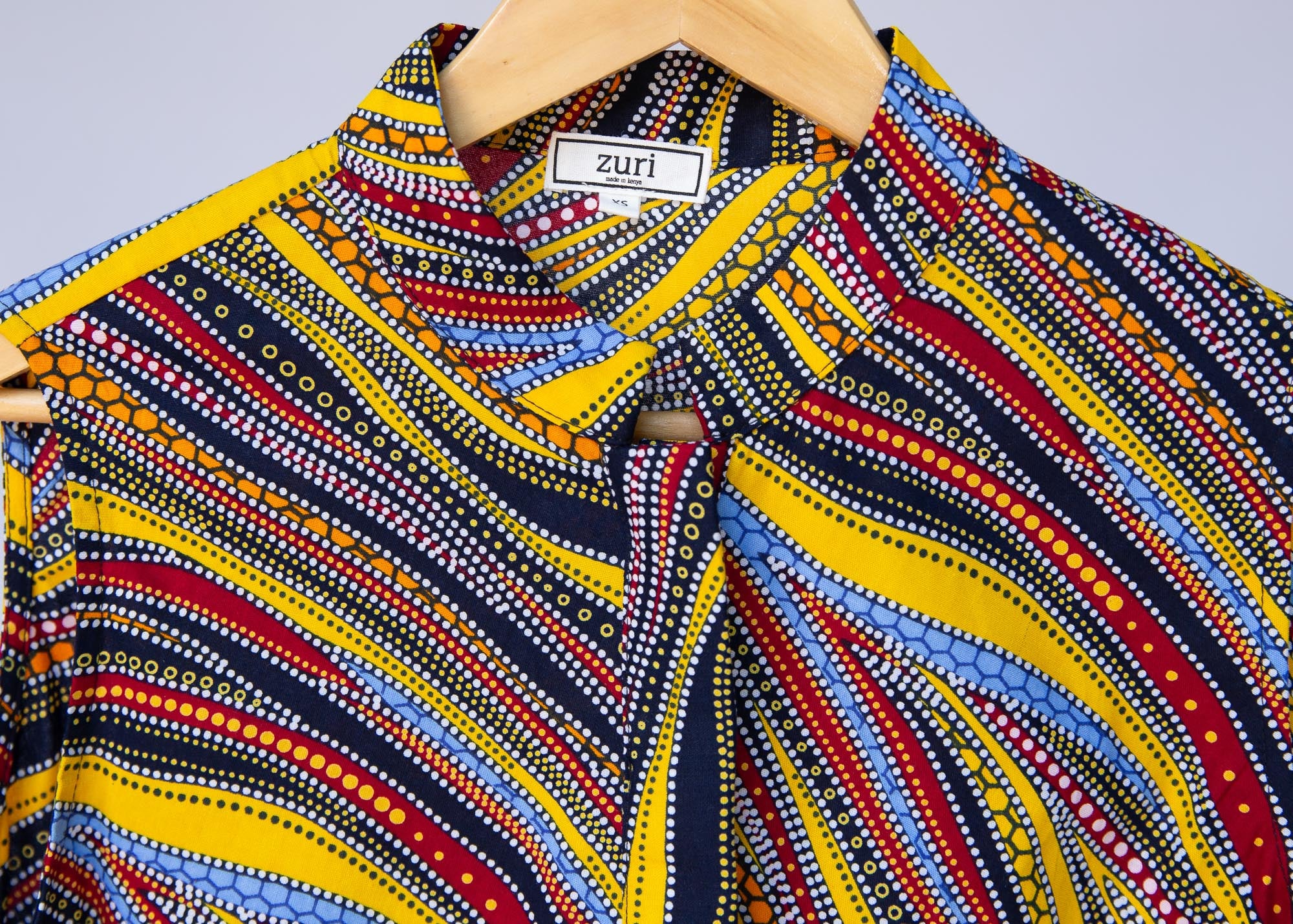 Display of  multi-colored abstract print dress