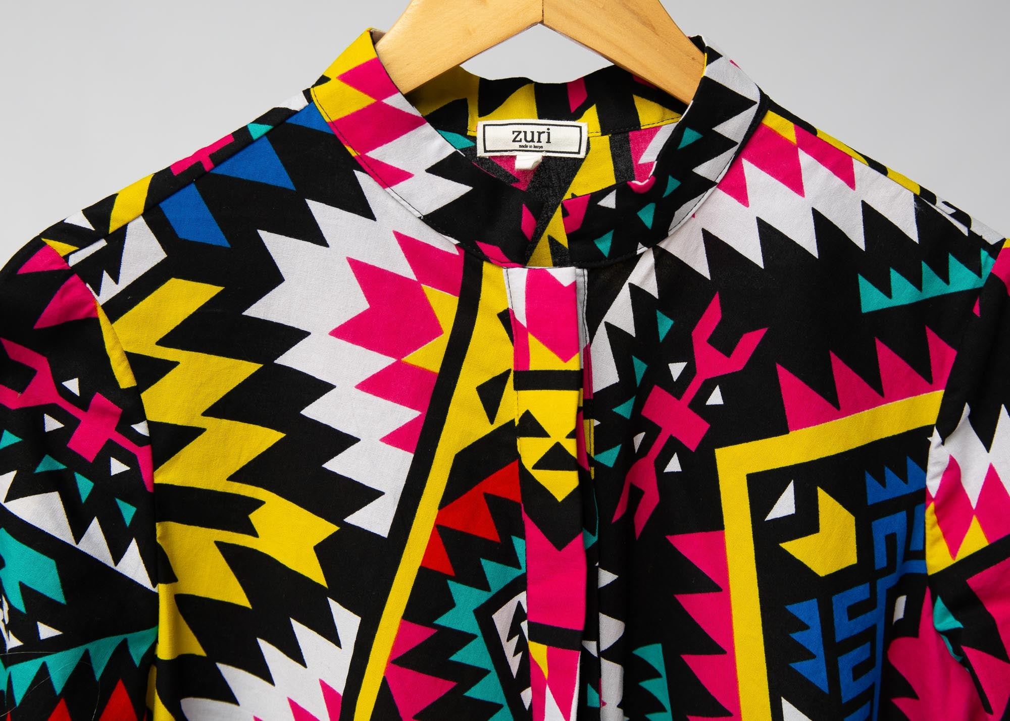 Display of multi colored geometric print dress