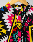Display of multi colored geometric print dress