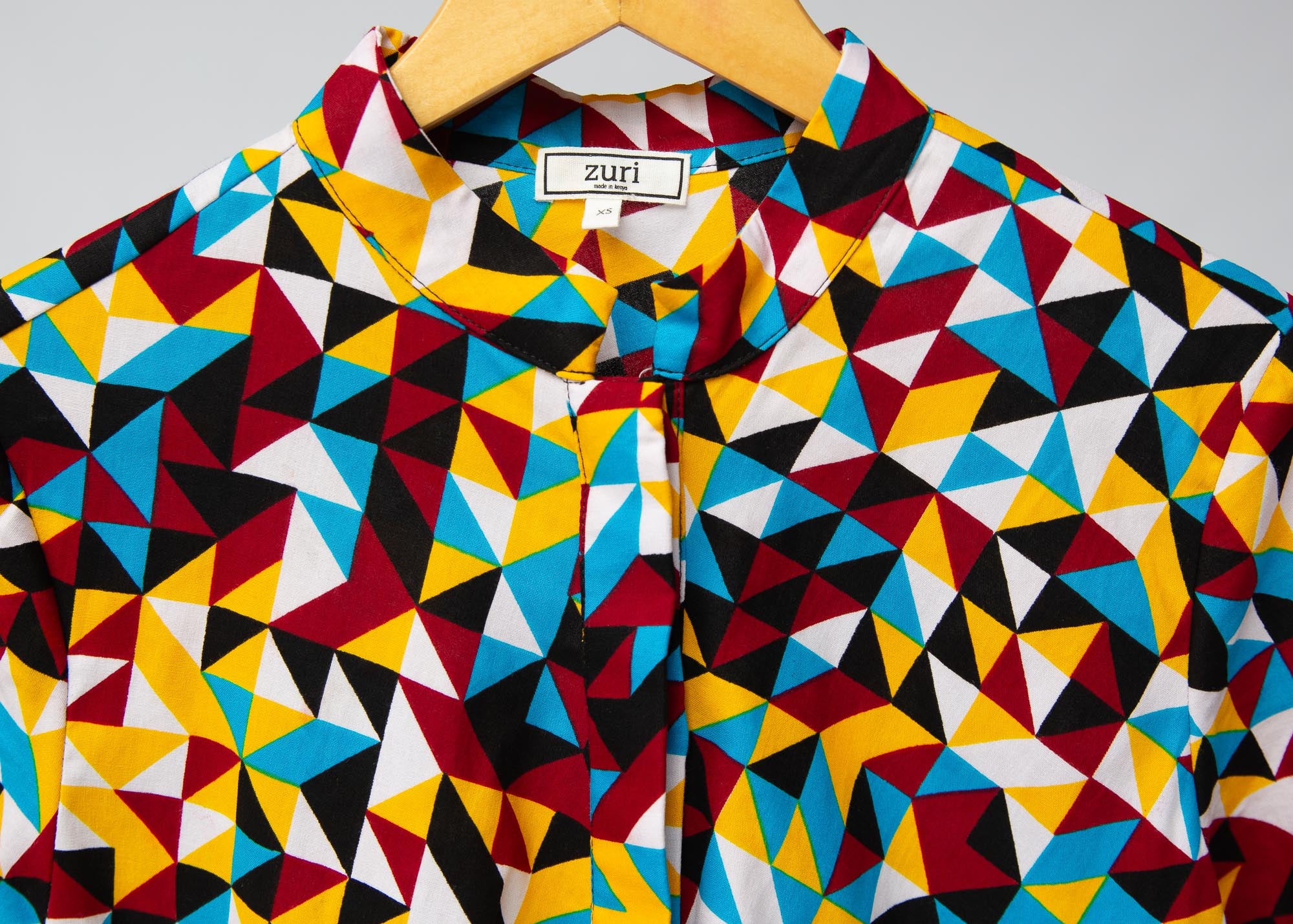 Display of multi colored geometric print dress