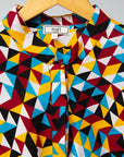 Display of multi colored geometric print dress