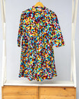 Display of multi colored geometric print dress
