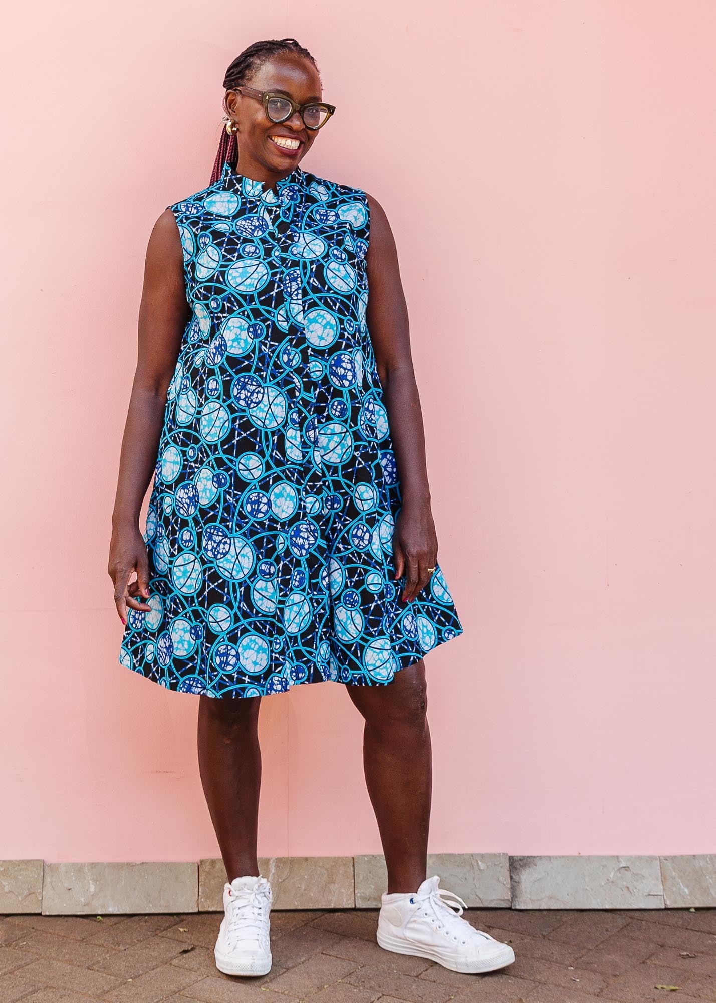 The model is wearing black dress with blue white and aqua colored full moon