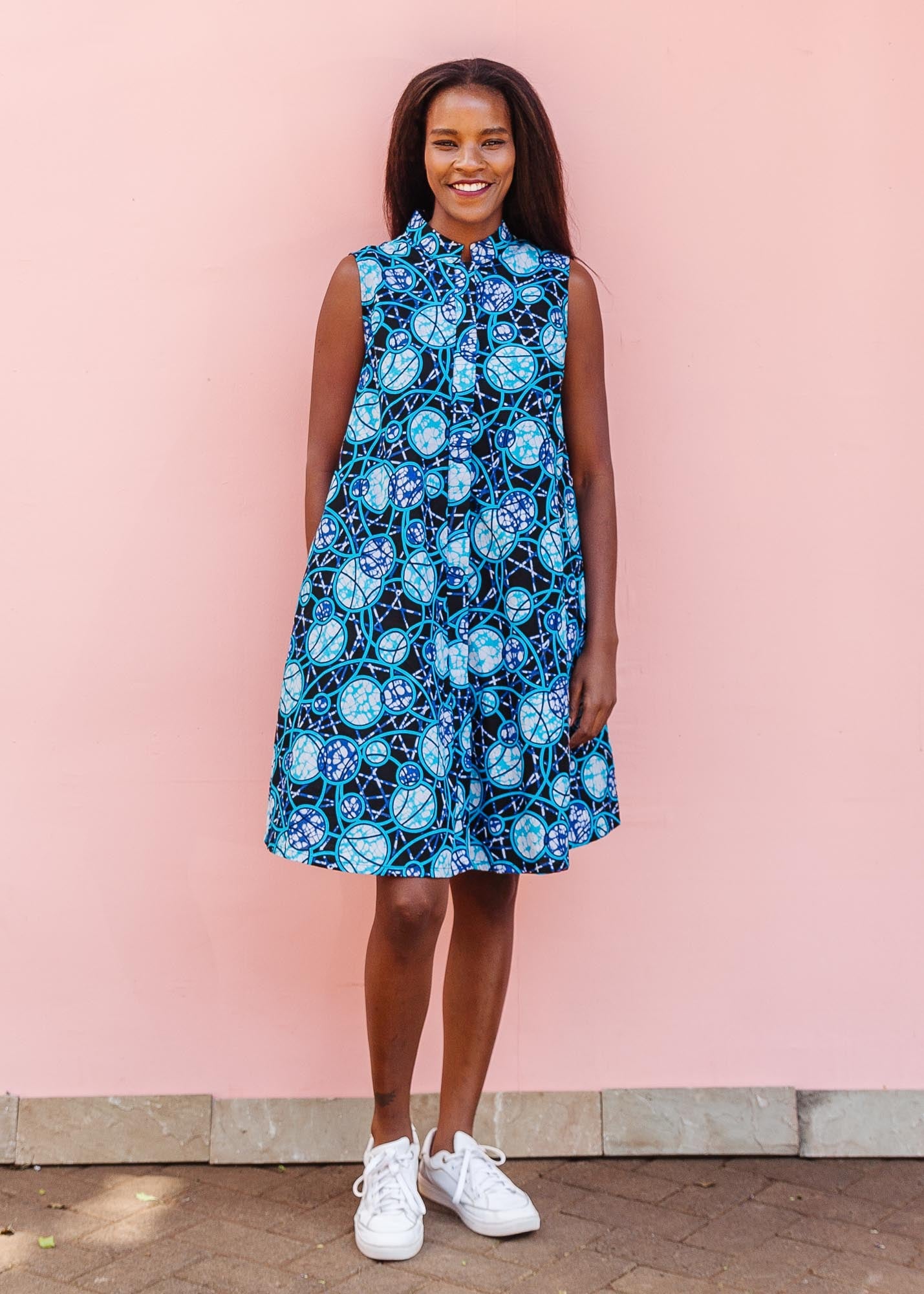 The model is wearing black dress with blue white and aqua colored full moon