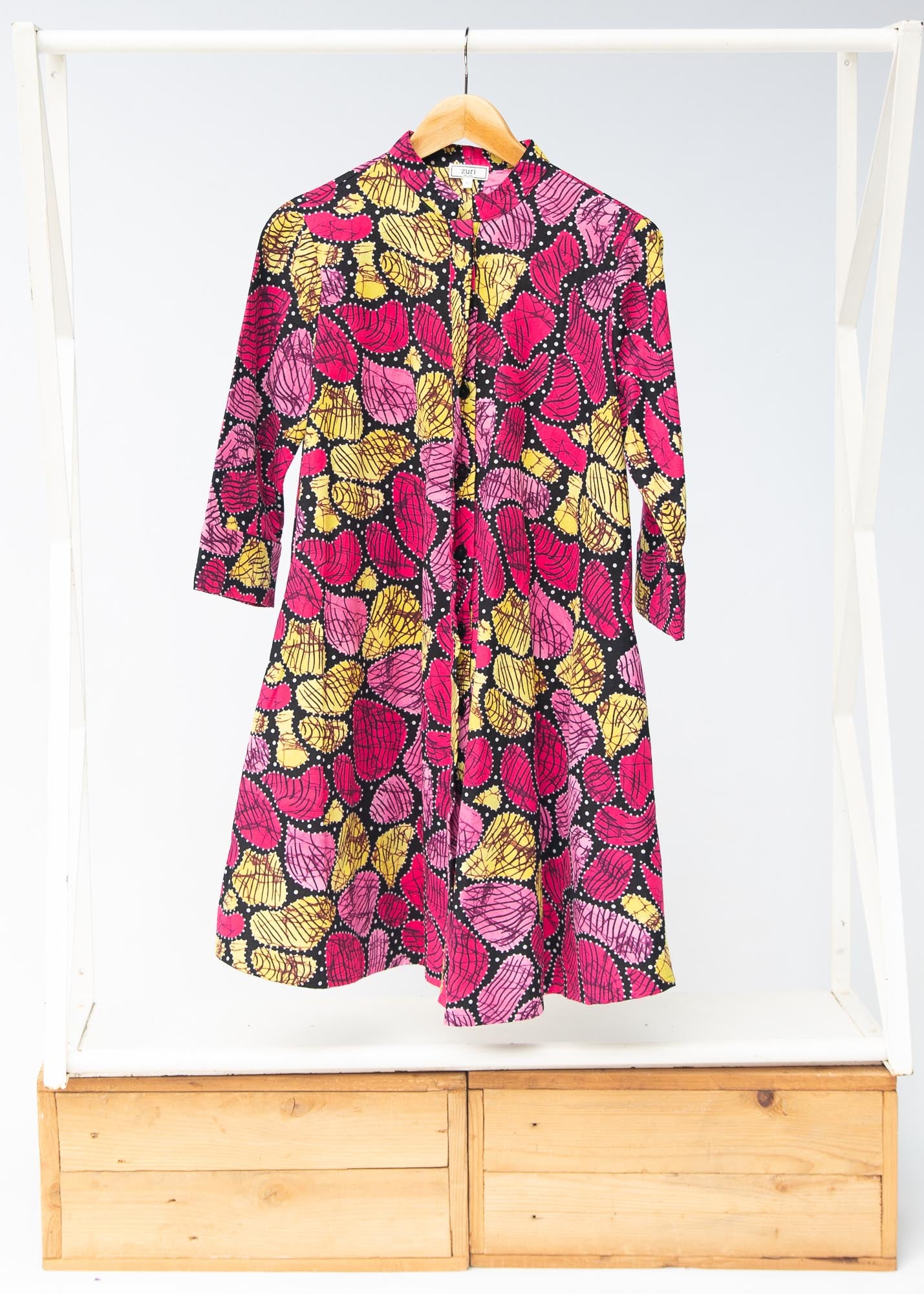 Display of black, white, yellow, brown, pink, hot pink and purple bubble print dress