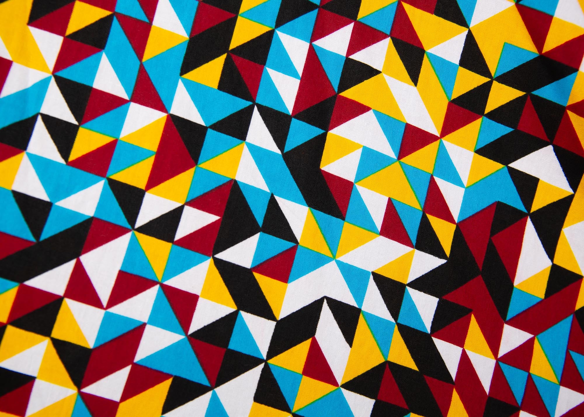 Close up display of multi colored geometric print dress