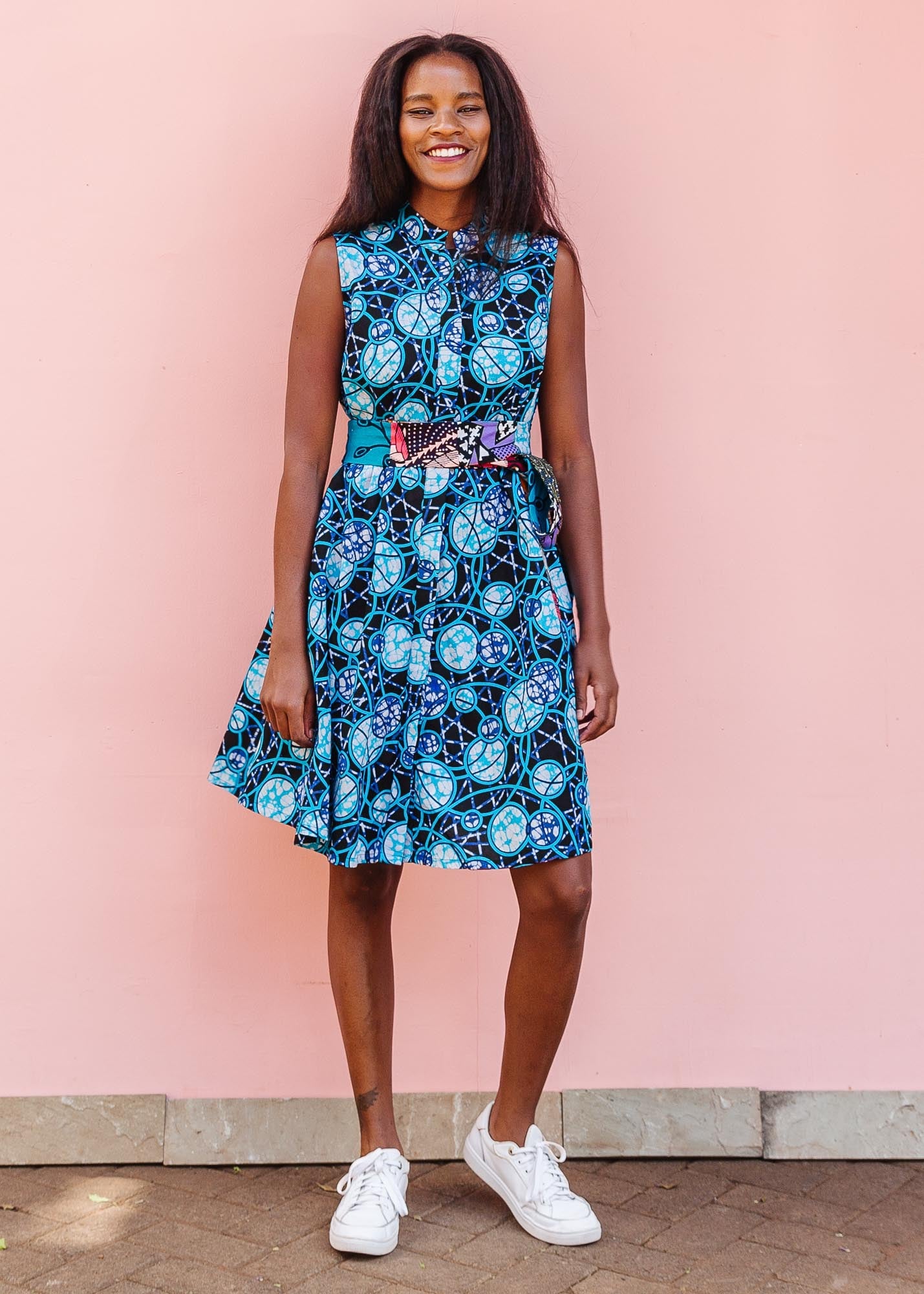 The model is wearing black dress with blue white and aqua colored full moon