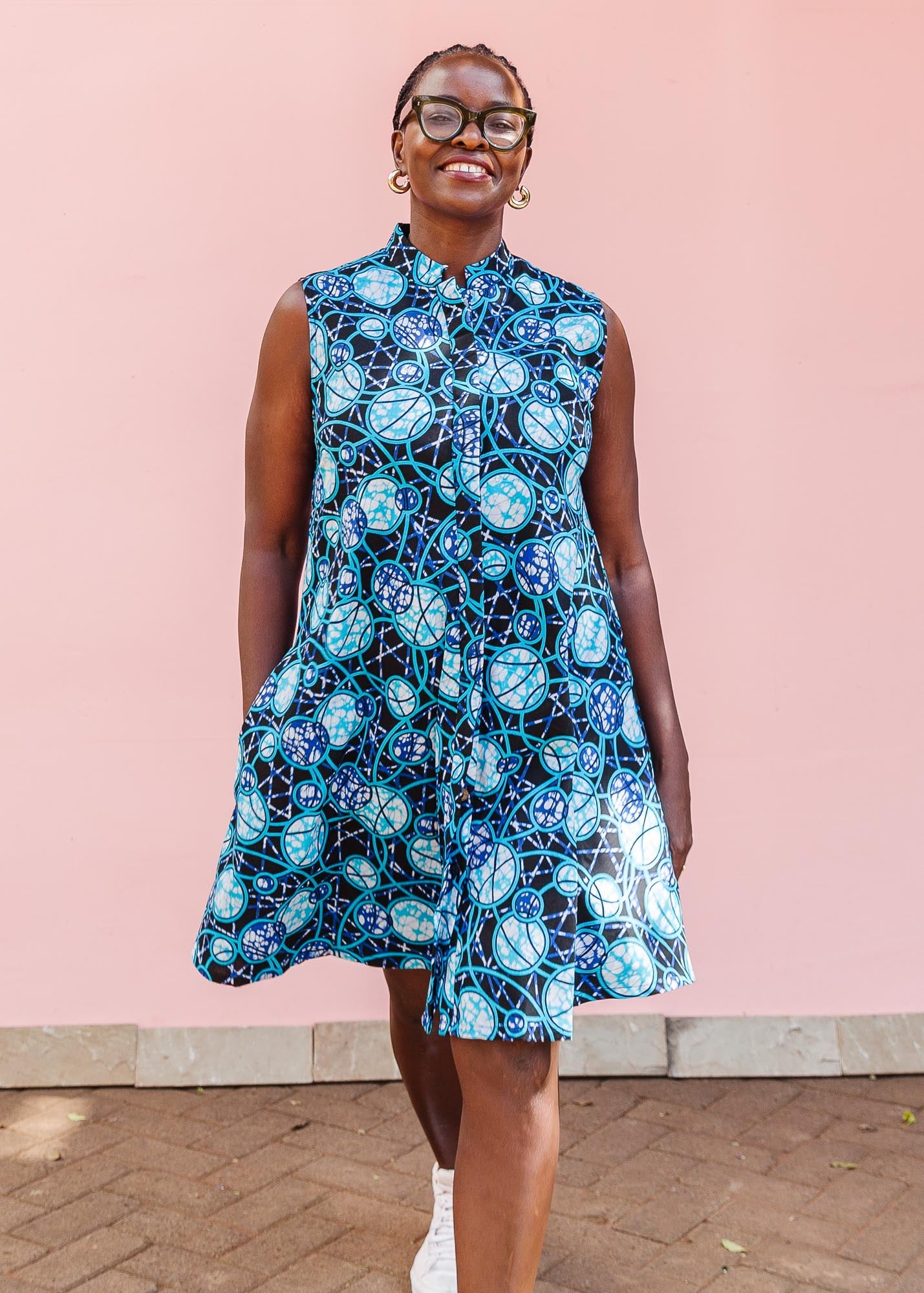 The model is wearing black dress with blue white and aqua colored full moon