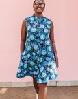 The model is wearing black dress with blue white and aqua colored full moon