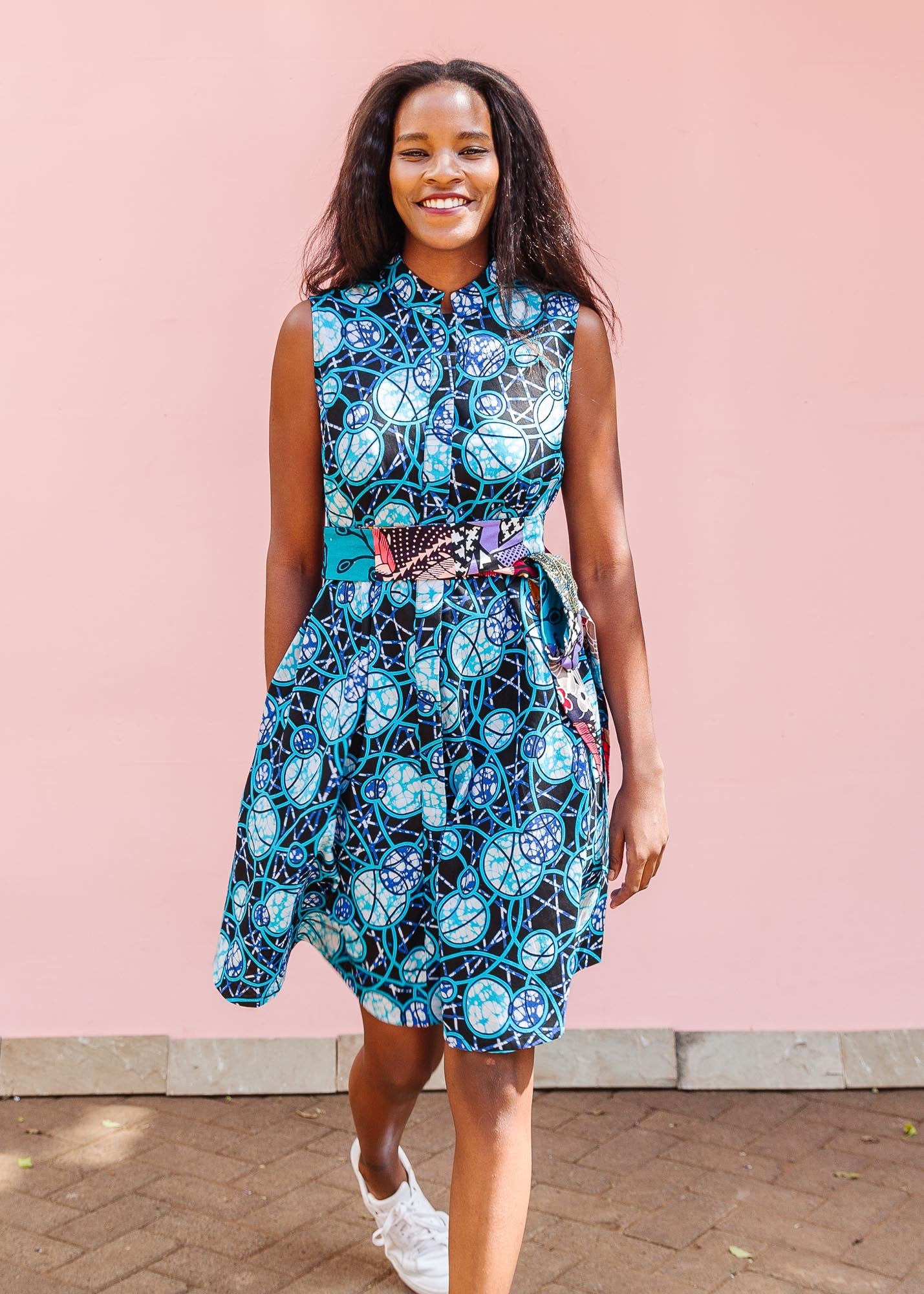 The model is wearing black dress with blue white and aqua colored full moon