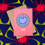 Coral color greeting card with purple and blue heart.