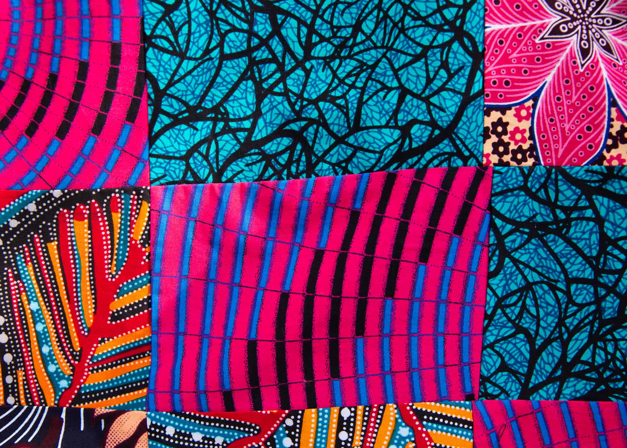 Close up display of patchwork tank, fabric.