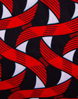 Display of red, black and white ribbon print dress, fabric.