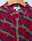 Display of red and pink geometric print dress.