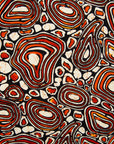 Close up display of brown, black and white pebble print dress, fabric.