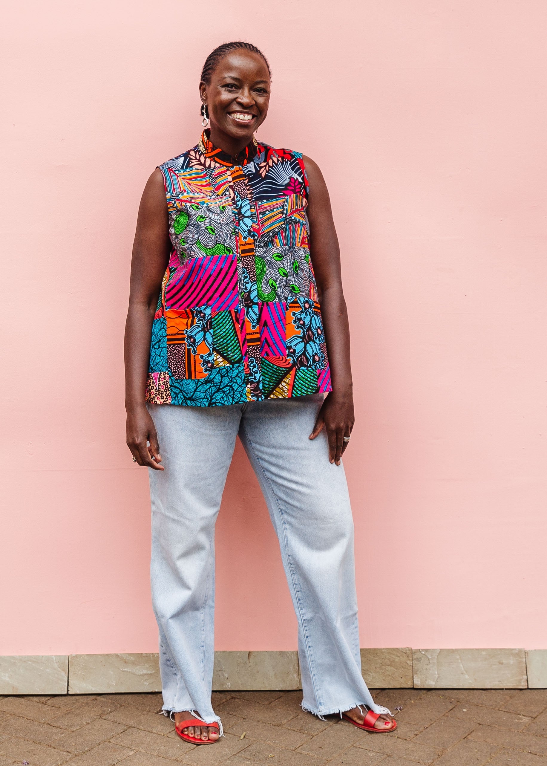 Model wearing patchwork tank.