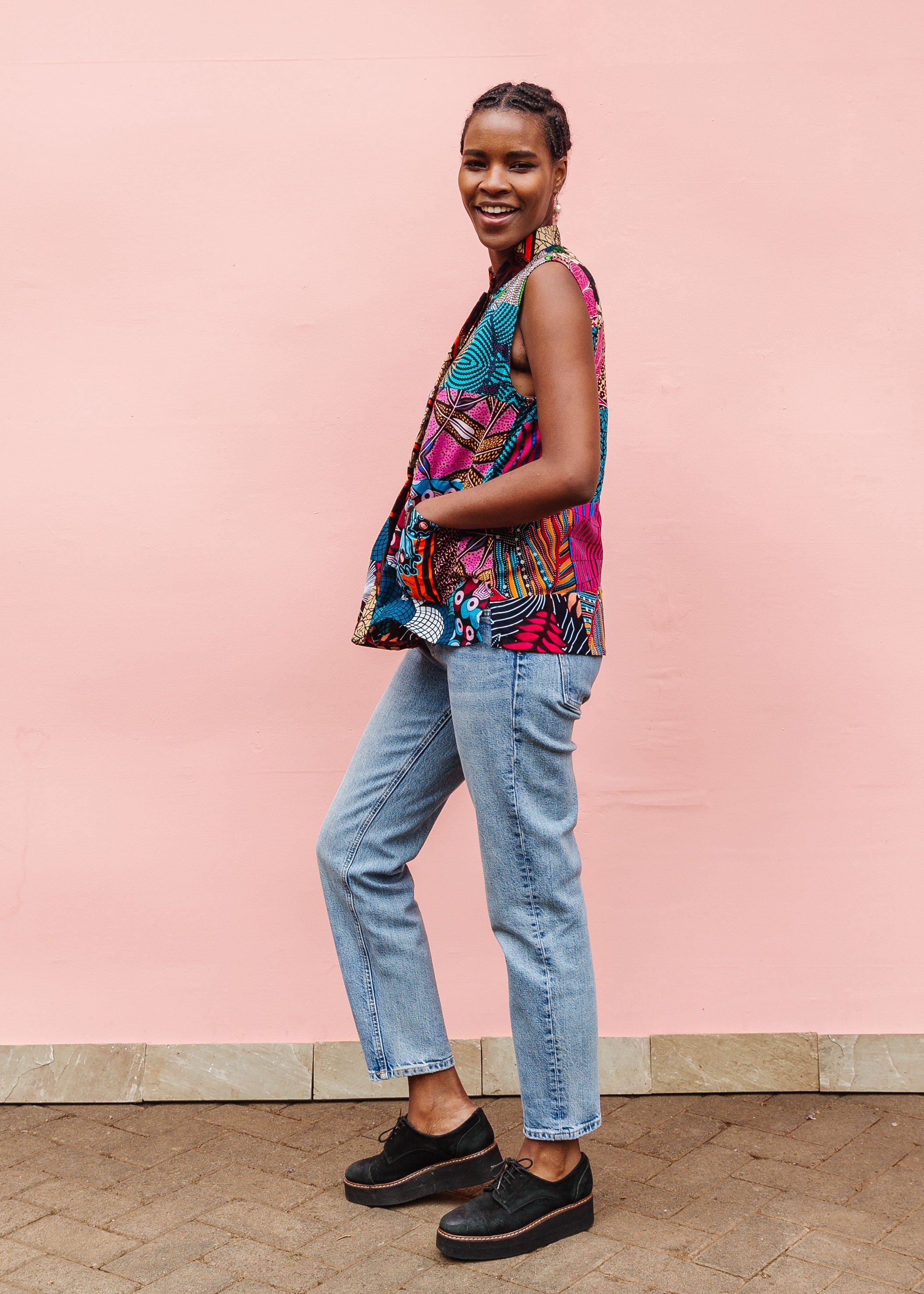 Model wearing patchwork tank.