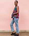 Model wearing patchwork tank.