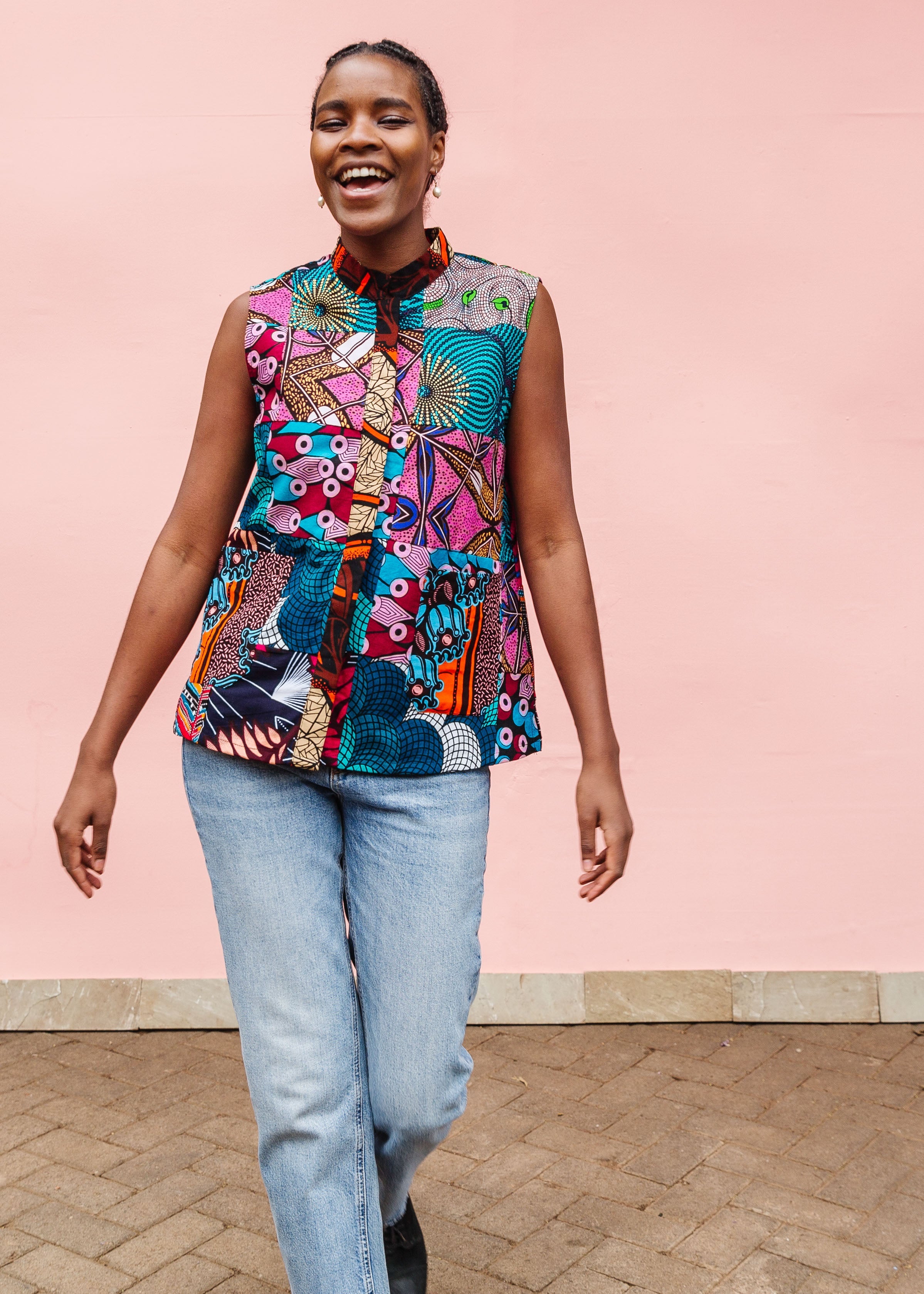 Model wearing patchwork tank.