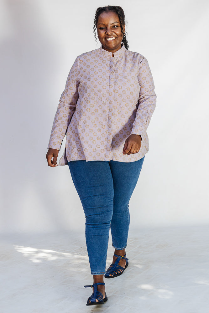Model wearing linen top with small flower print.