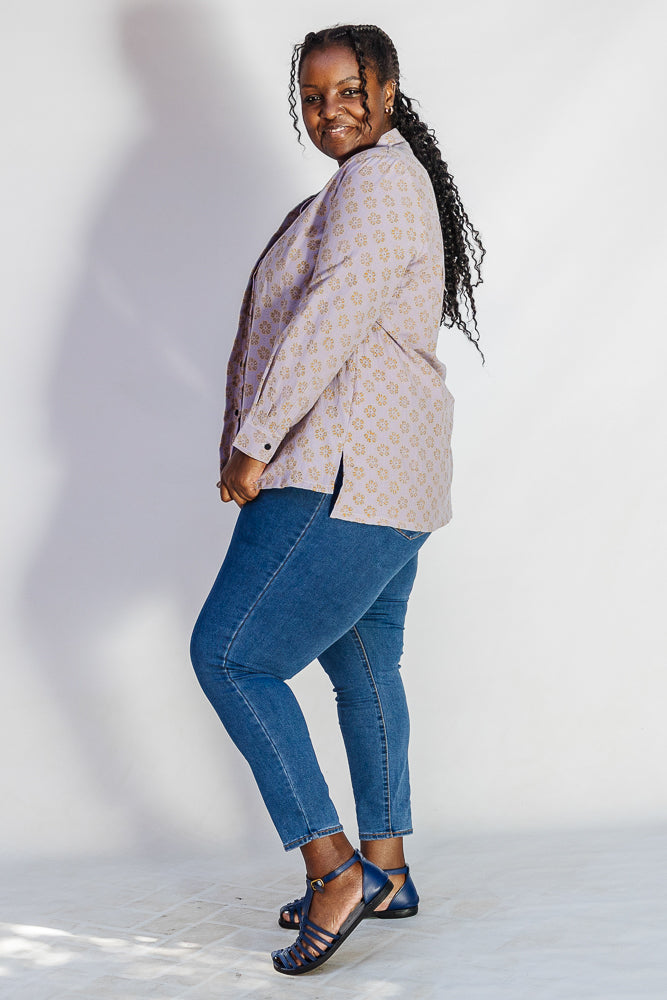 Model wearing linen top with small flower print.