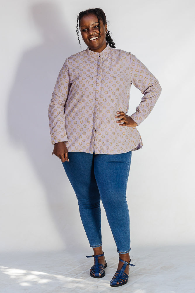 Model wearing linen top with small flower print.