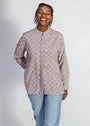 Model wearing linen top with small flower print.