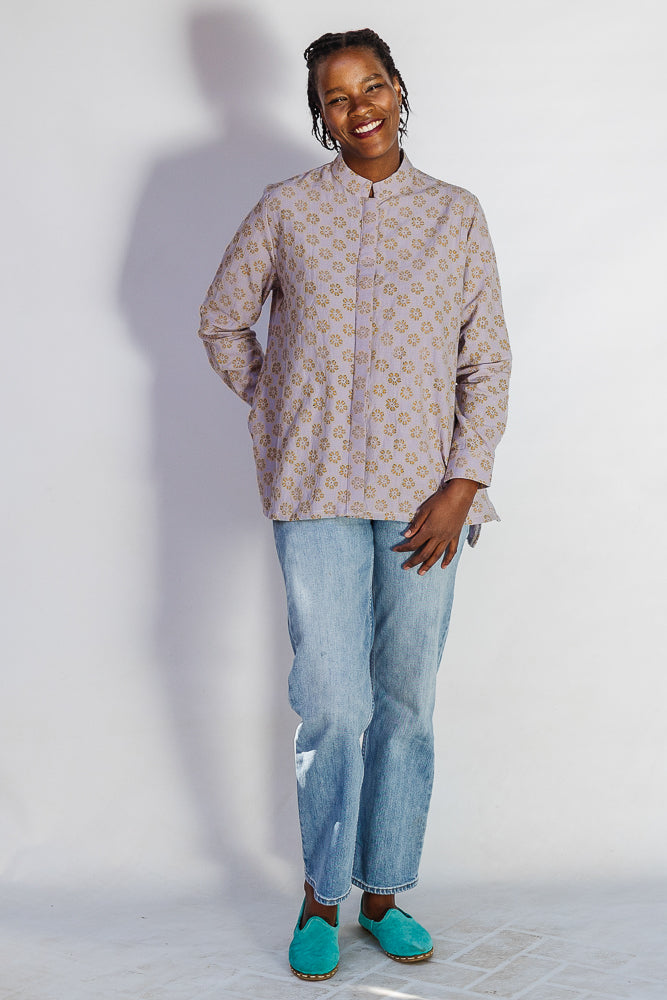 Model wearing linen top with small flower print.