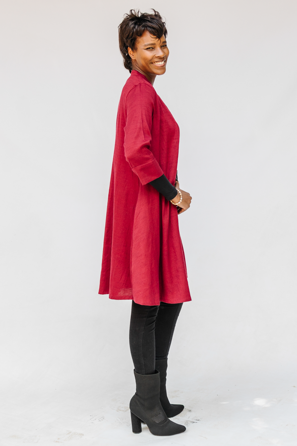 Model wearing burgundy linen dress.