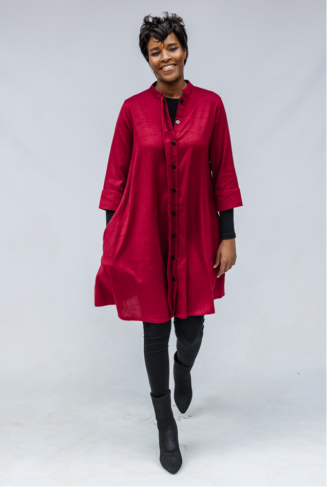 Model wearing burgundy linen dress.