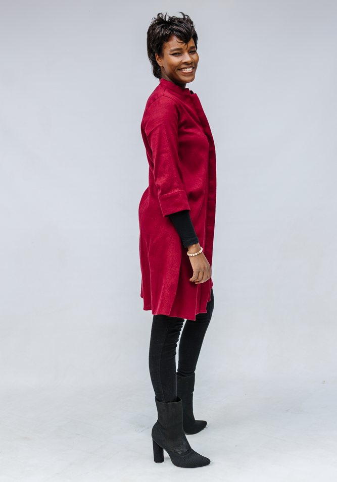 Model wearing burgundy linen dress.