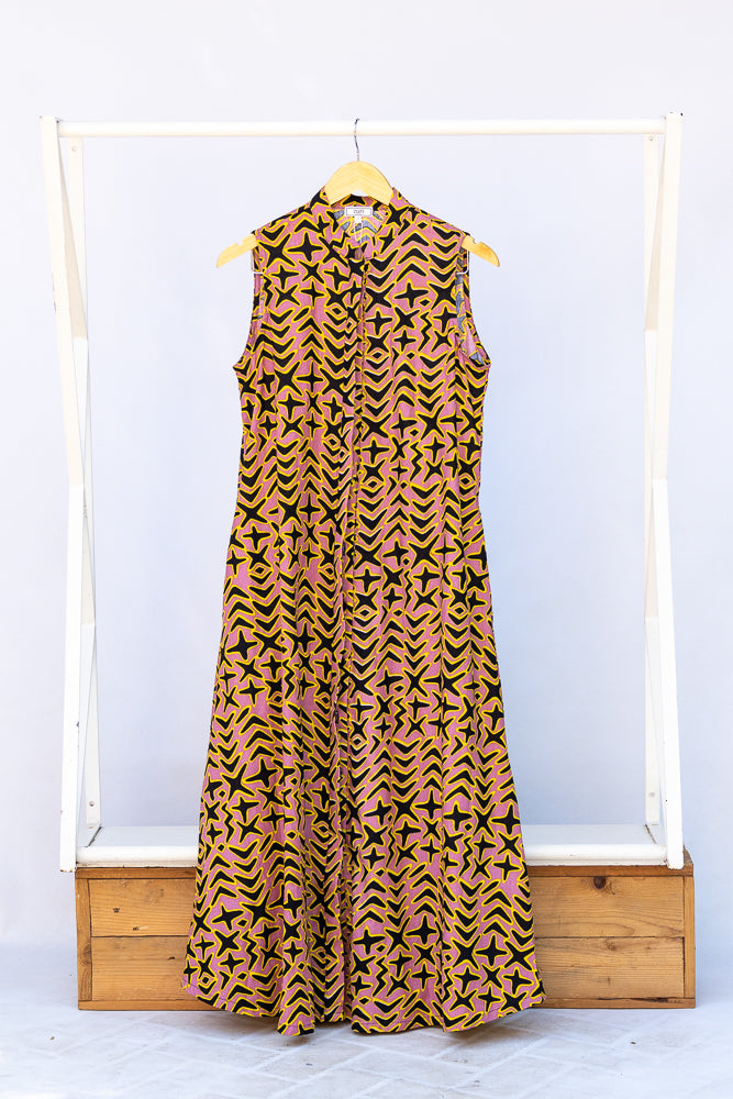 Display of beige, yellow and black geometric print dress.