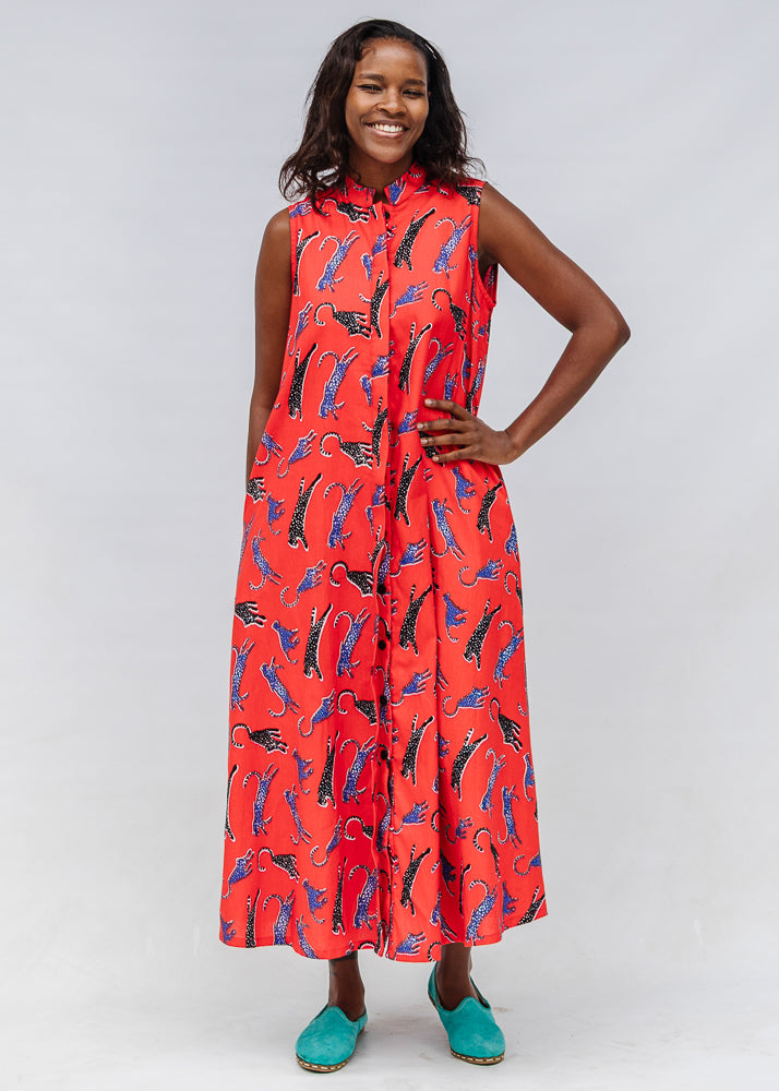 Model wearing red, cat print dress.