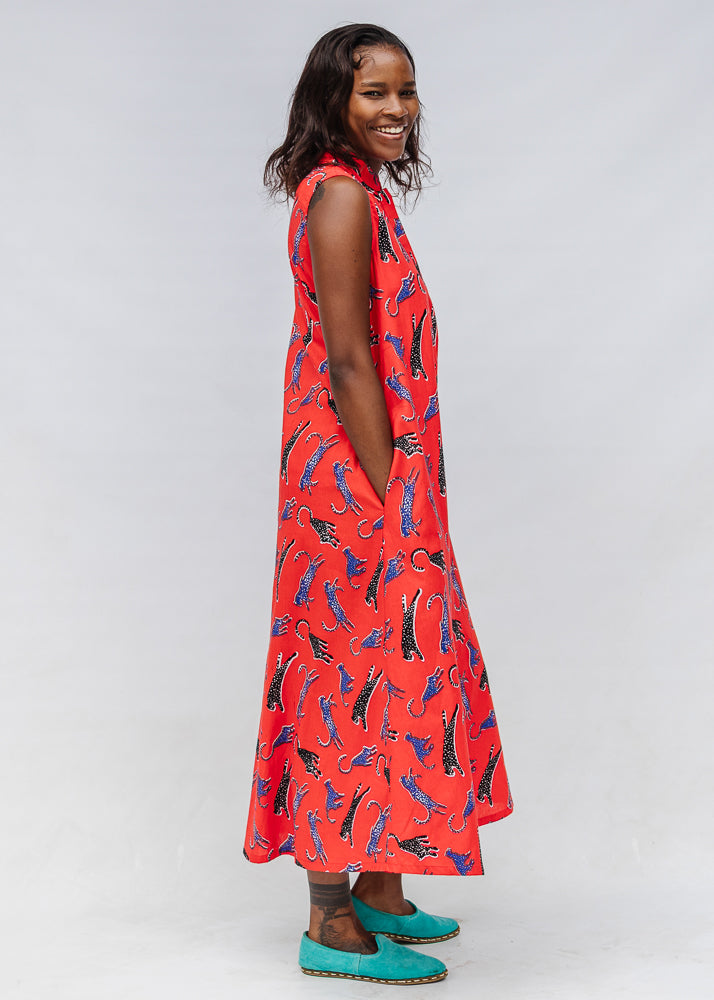 Model wearing red, cat print dress.
